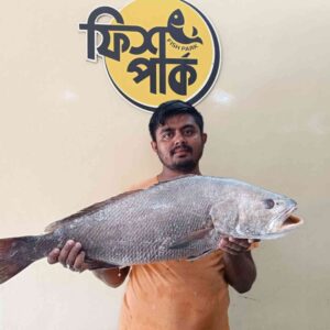 Fresh Black Koral premium sea fish held by a seafood seller at Fish Park in Bangladesh