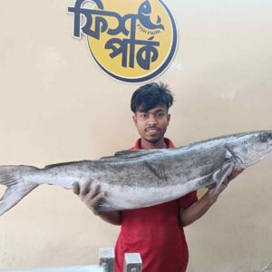 Young Bangladeshi fish seller holding a large fresh river fish at a local fish market in Bangladesh with Fish Park logo in the background.